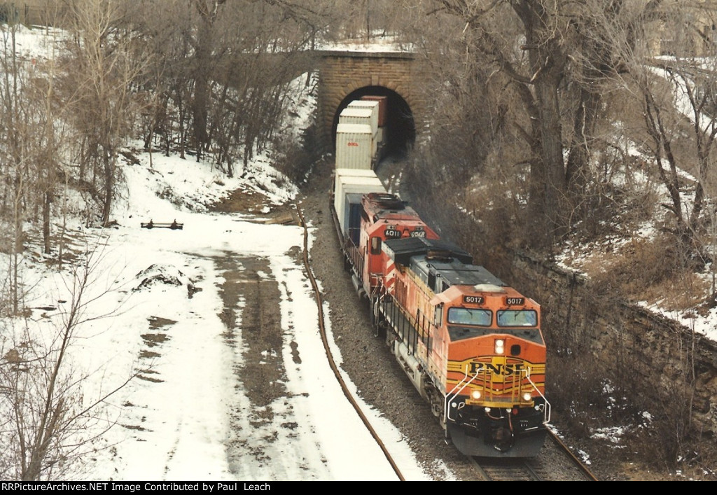 Eastbound stack train pops out of the tunnel